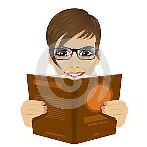 Young beautiful woman with glasses reading a book