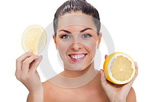 Young beautiful woman with half of lemon