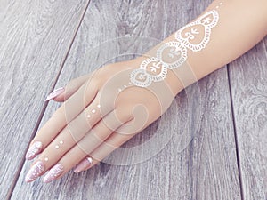 Young beautiful woman hands with elegant manicure