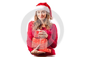 Young beautiful woman in hands holding a new year christmas holiday gift