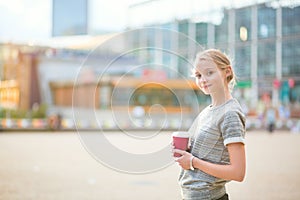 Young beautiful woman having her coffee break