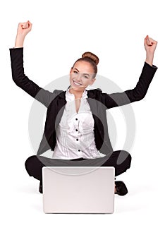 Young beautiful woman having online shopping, arms outstretched
