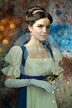 A young beautiful woman in a historical dress with flowers on a colorful blue background. Book Cover