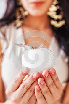 Young beautiful woman hold the apple of youth