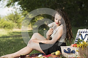 Young beautiful woman holding a blossom flower