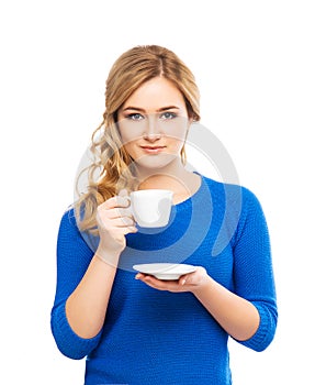Young and beautiful woman holding a cup of coffee
