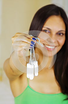 Young beautiful woman holding menstruation cotton tampon