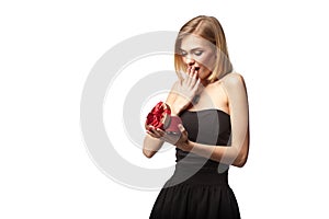 Young beautiful woman holding small red box. Studio portrait iso