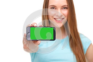 Young beautiful woman holding smartphone with copyspace