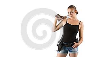 Young beautiful woman holding a sport gun on white background