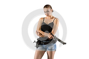 Young beautiful woman holding a sport gun on white background