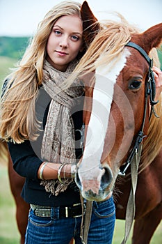 Young beautiful woman with horse