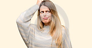 Young beautiful woman isolated over yellow background