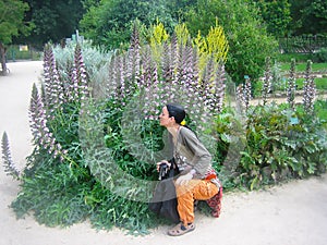 Young beautiful woman in Jardin des Plantes, Paris