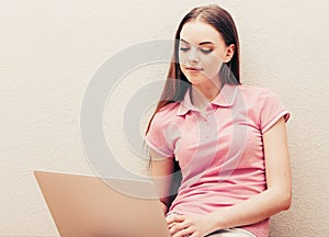 Young beautiful woman with laptop notebook on floor home surfing internet
