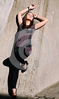 Young beautiful woman lean by