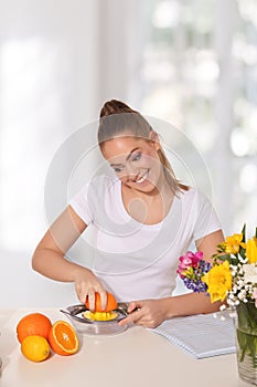 Young beautiful woman licking lemon with grimace on her face photo