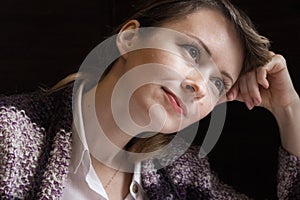 Young beautiful woman looking away and dreaming. Pretty girl with brown eyes thinking closeup. Daydreaming concept.