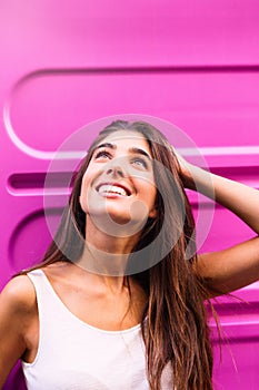 Young beautiful woman looking up