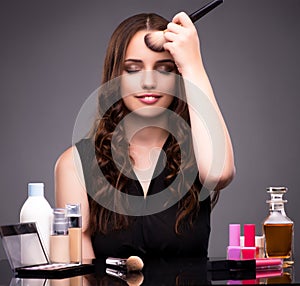Young beautiful woman during make-up session