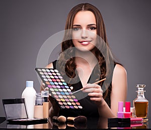 Young beautiful woman during make-up session