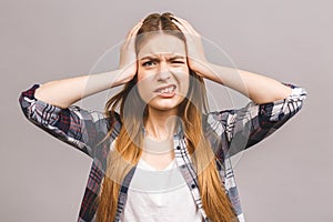 Young beautiful woman over isolated background suffering from headache desperate and stressed because pain and migraine. Hands on