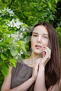 Young, beautiful, woman in park on walk