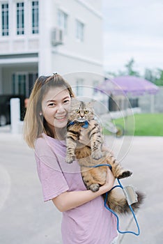 Young beautiful woman with persian cat.