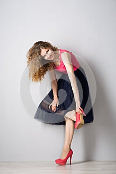 Young beautiful woman in pink shoes