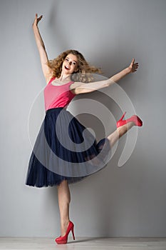 Young beautiful woman in pink shoes