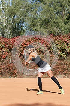 Young beautiful woman is playing tennis. In full growth.