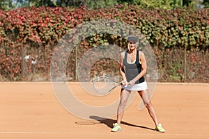 Young beautiful woman is playing tennis. In full growth.