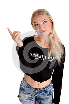 Young beautiful woman pointing an advertisiment sale by finger
