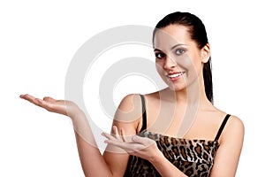 A young beautiful woman pointing at copyspace