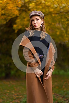 Young beautiful woman posing on city street