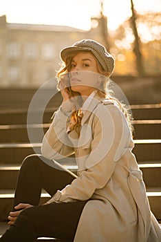 Young beautiful woman posing on city street