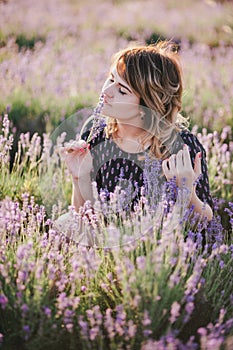 Young beautiful woman posing in a lavender field