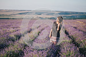 Young beautiful woman posing in a lavender field