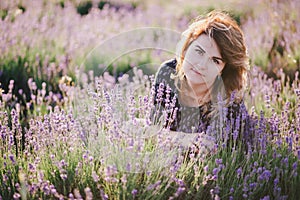 Young beautiful woman posing in a lavender field