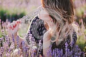 Young beautiful woman posing in a lavender field