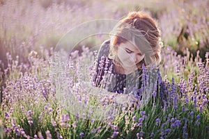 Young beautiful woman posing in a lavender field