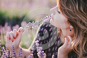 Young beautiful woman posing in a lavender field