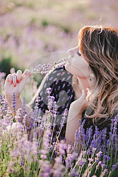 Young beautiful woman posing in a lavender field