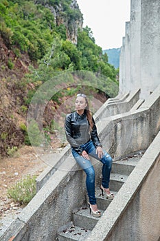 Young beautiful woman posing sitting