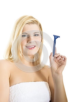 Young beautiful woman with razor ready to shave