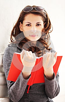 Young beautiful woman reading a book