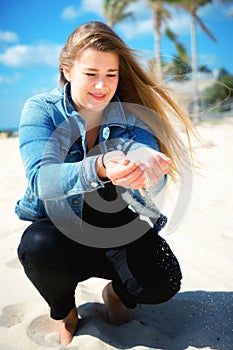 Young beautiful woman in Relaxation On Tropical Beach of with sa