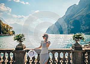 Young beautiful woman relaxing on picturesque Garda Lake