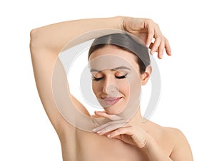 Young beautiful woman showing armpit with clean skin on white background