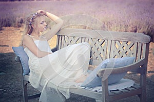 Young and beautiful woman sitting on a bench